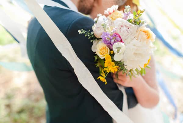 Lorna Syson handmade wedding with nature-inspired fabric details and colourful decorations
