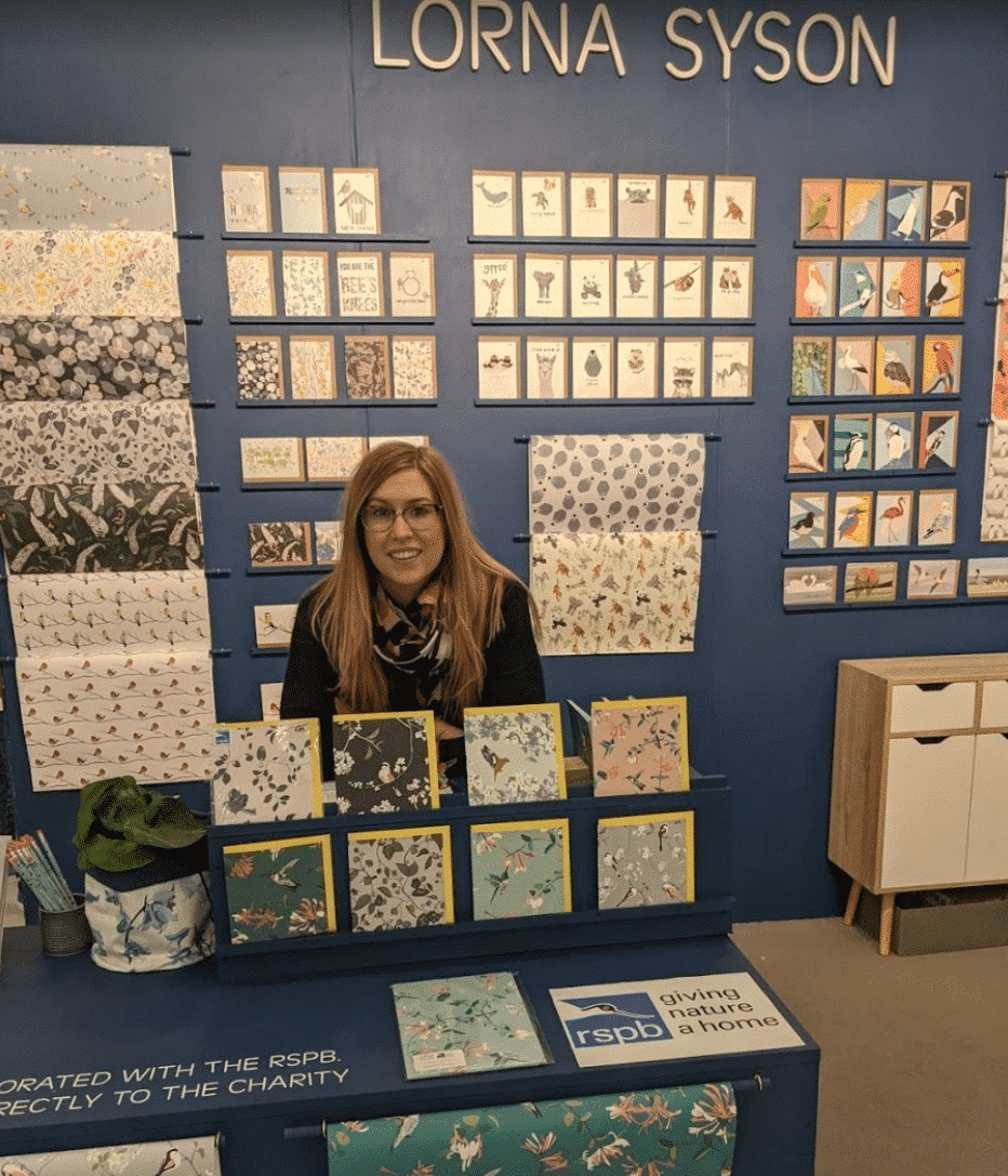 Lorna syson at top drawer trade show with stationery collection and rspb design