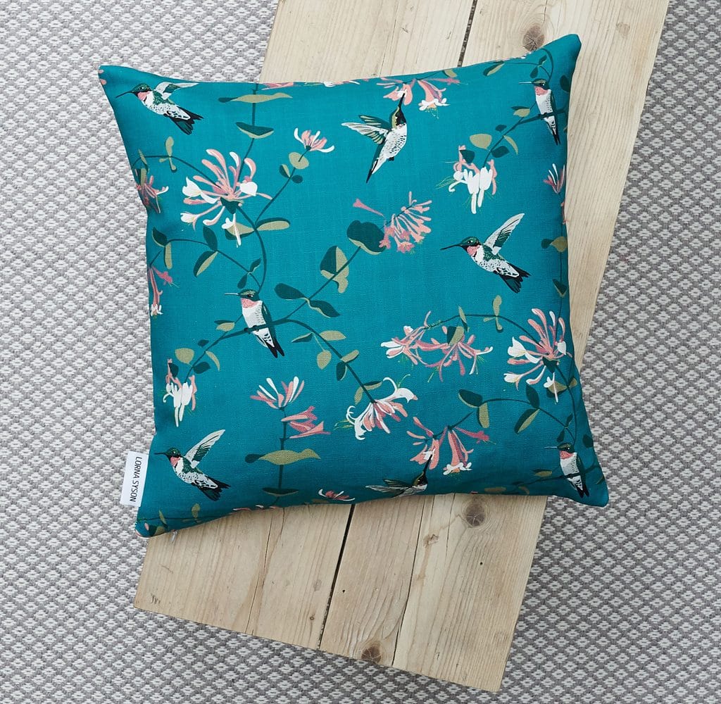 cushion, bird cushion, floral cushion, luxury cushion, designer cushion, uk designer, RSPB cushion, designer home, designer interiors, bird design, hummingbird teal design for the RSPB designed by Lorna Syson