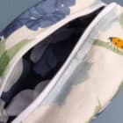blue hydrangea wash bag with orange ladybirds, make up bag, toiletries bag, cosmetic bag, wash bag, made in the UK, 100% cotton, bird make up bag