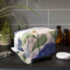 blue hydrangea wash bag with orange ladybirds, make up bag, toiletries bag, cosmetic bag, wash bag, made in the UK, 100% cotton, bird make up bag