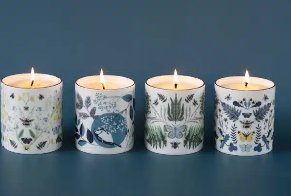 Ceramic candle pot decorated with an illustrated bird and floral pattern, matching the same design found on Lorna Syson homewares