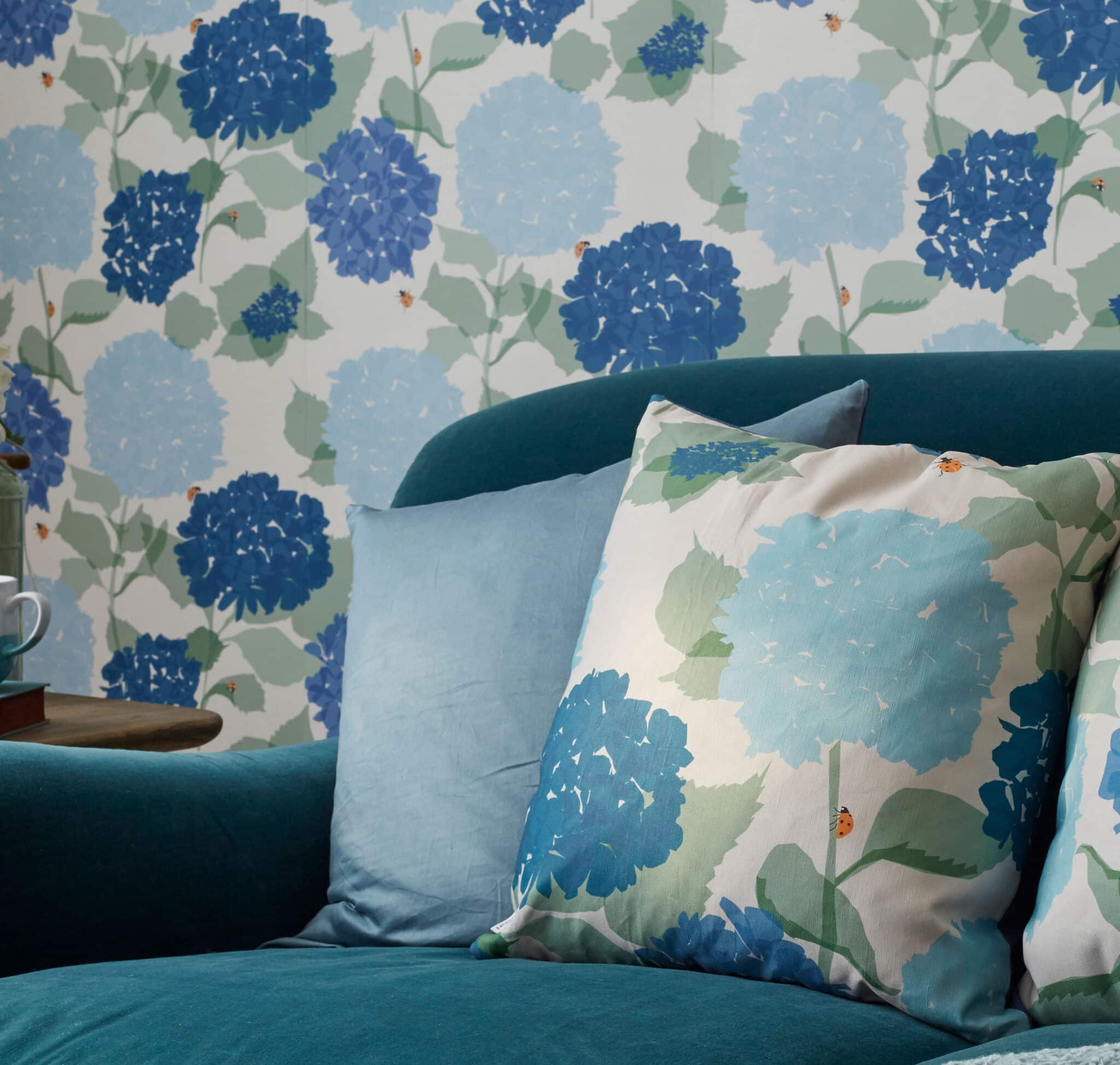 hydrangea cushion with lady bird by lorna syson