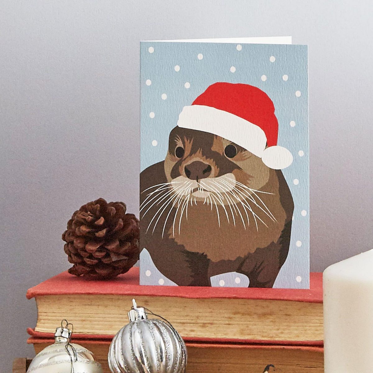 Christmas Card Luxury Designer Personalised Message Sustainable Environmentally Friendly paper from an FSC-certified supplier Plastic Free - otter Christmas greeting card by Lorna Syson